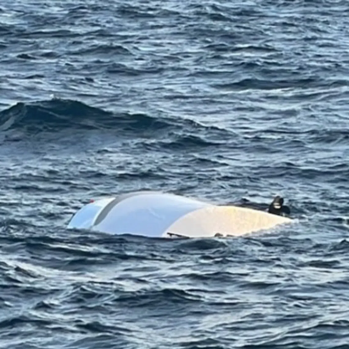 The capsized motorboat used by three men who were rescued early on Aug 10 after being found clinging to it near Choji Island off Ongjin County.