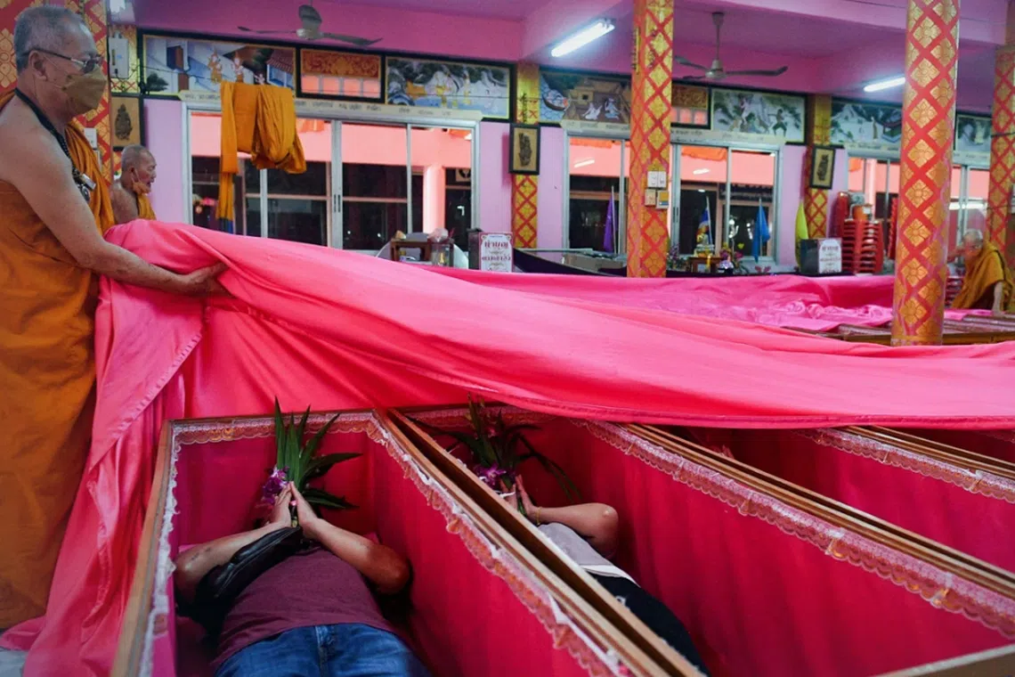 Buddhist monks then chant prayers over the coffins while those inside devote the merit made to their deceased family members. 
