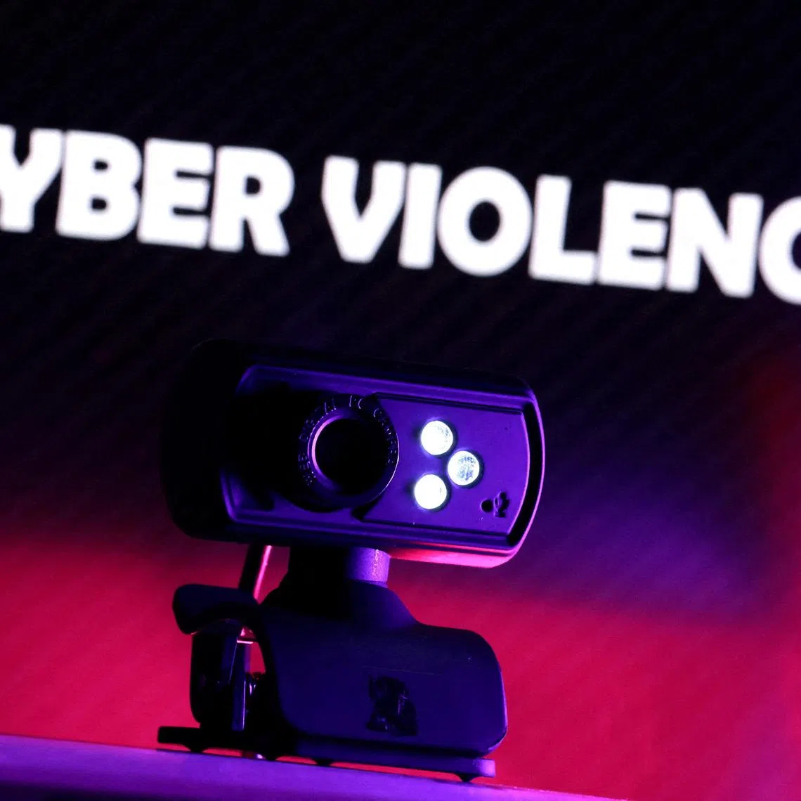 FILE PHOTO: A web camera is seen in front of the displayed words \"Cyber violence\" in this illustration taken October 21, 2025. REUTERS/Dado Ruvic/Illustration/File Photo
