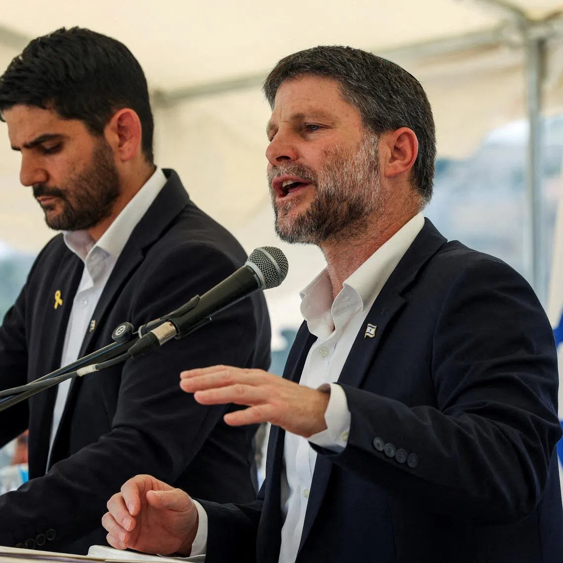FILE PHOTO: Israeli Finance Minister Bezalel Smotrich speaks at a press conference regarding settlements expansion for the long-frozen E1 settlement, that would split East Jerusalem from the occupied West Bank, near the Israeli settlement of Maale Adumim in the Israeli-occupied West Bank, August 14, 2025. REUTERS/Ronen Zvulun/File Photo