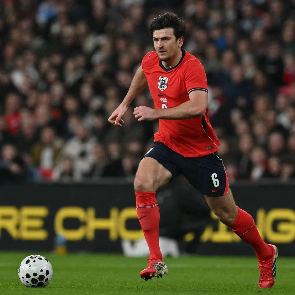 England defender Harry Maguire running with the ball during the 1-1 friendly draw with Uruguay at Wembley Stadium in west London on March 27, 2026.