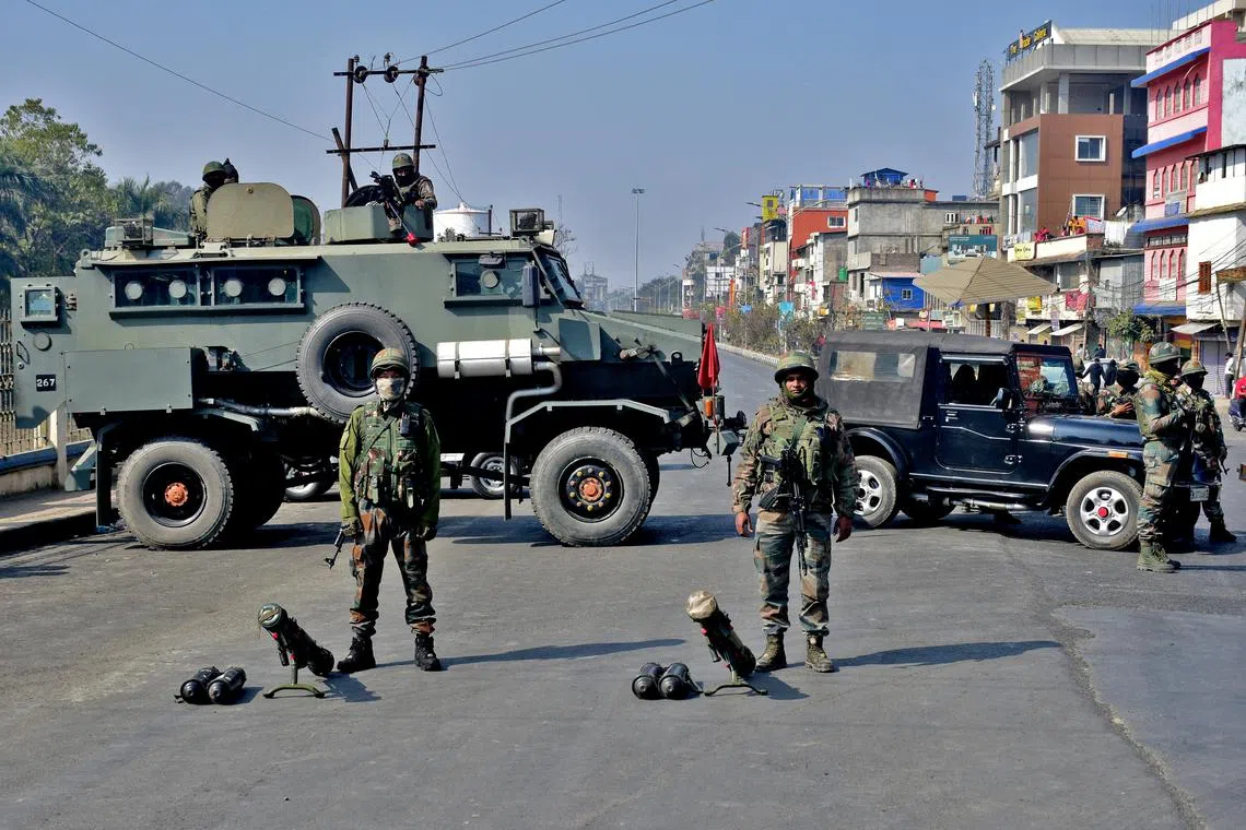 FILE PHOTO: Soldiers block a road leading to the Kangla Fort, the venue of a meeting between the state lawmakers and members of Arambai Tenggol, a Meitei group, in Imphal, Manipur, India, January 24, 2024. REUTERS/Stringer/File Photo