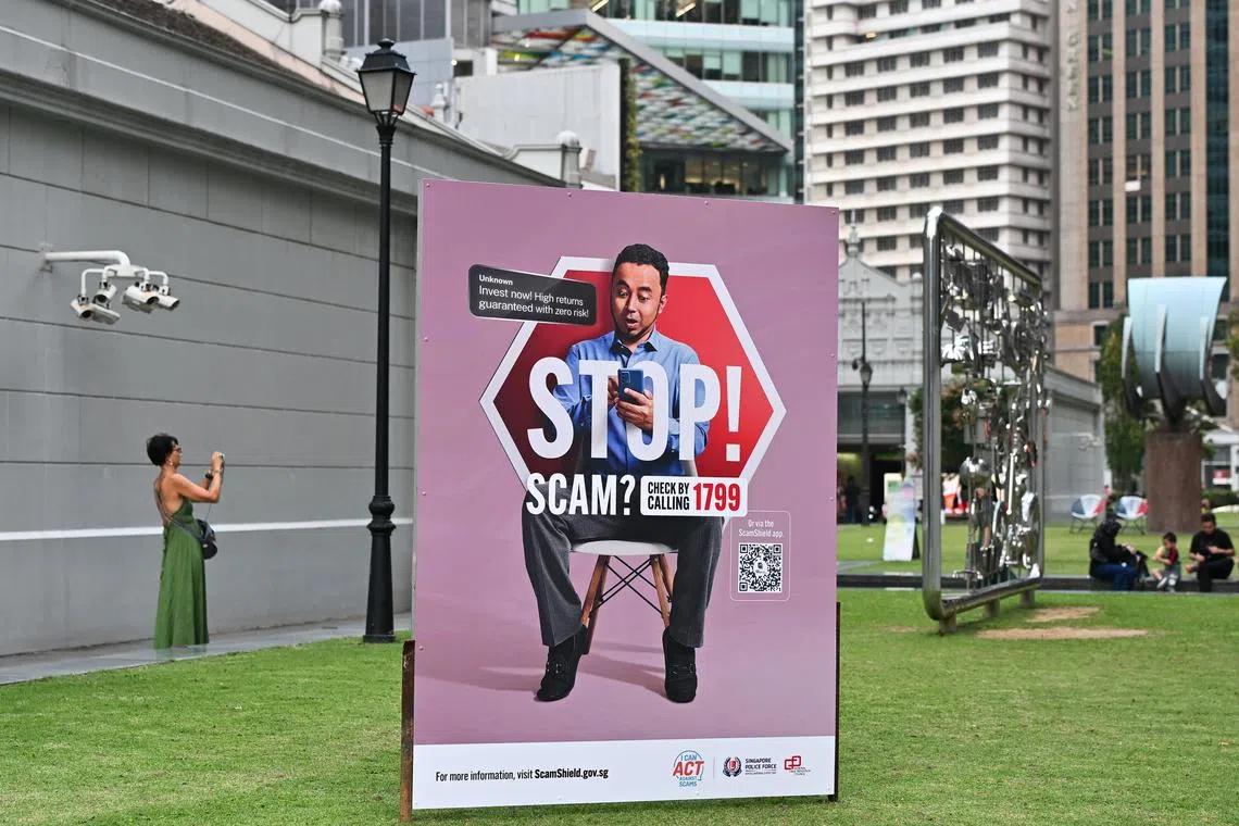 ST20250226-202556800625-Lim Yaohui-pixgeneric/ Police advisory on invest scam at Raffles Place Park within the heart of Singapore's financial centre in the CBD area on Feb 26, 2025. Can be used for stories on scam, scamshield, SMS, Whatsapp, Singapore Police Force, police, crime, and court. (ST PHOTO: LIM YAOHUI)