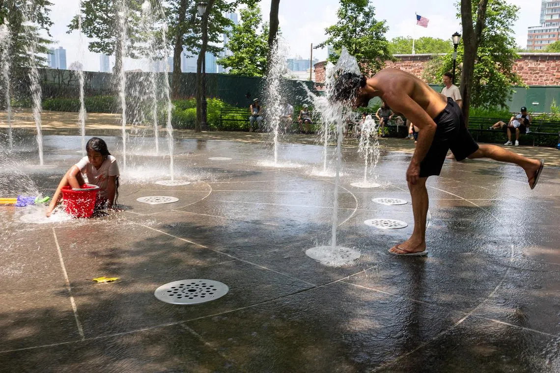 People trying to stay cool in Manhattan on June 23, 2025, in New York City.