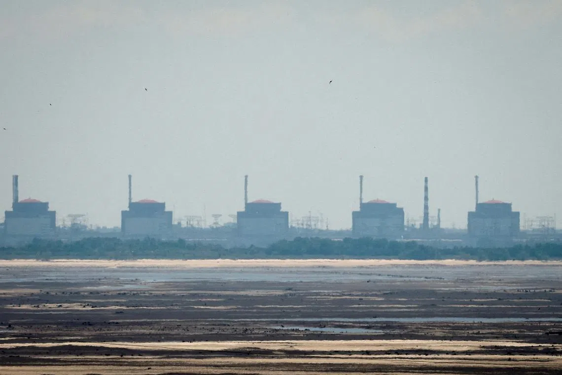 FILE PHOTO: A view shows Zaporizhzhia Nuclear Power Plant from the bank of Kakhovka Reservoir near the town of Nikopol after the Nova Kakhovka dam breached, amid Russia's attack on Ukraine, in Dnipropetrovsk region, Ukraine June 16, 2023. REUTERS/Alina Smutko/File Photo