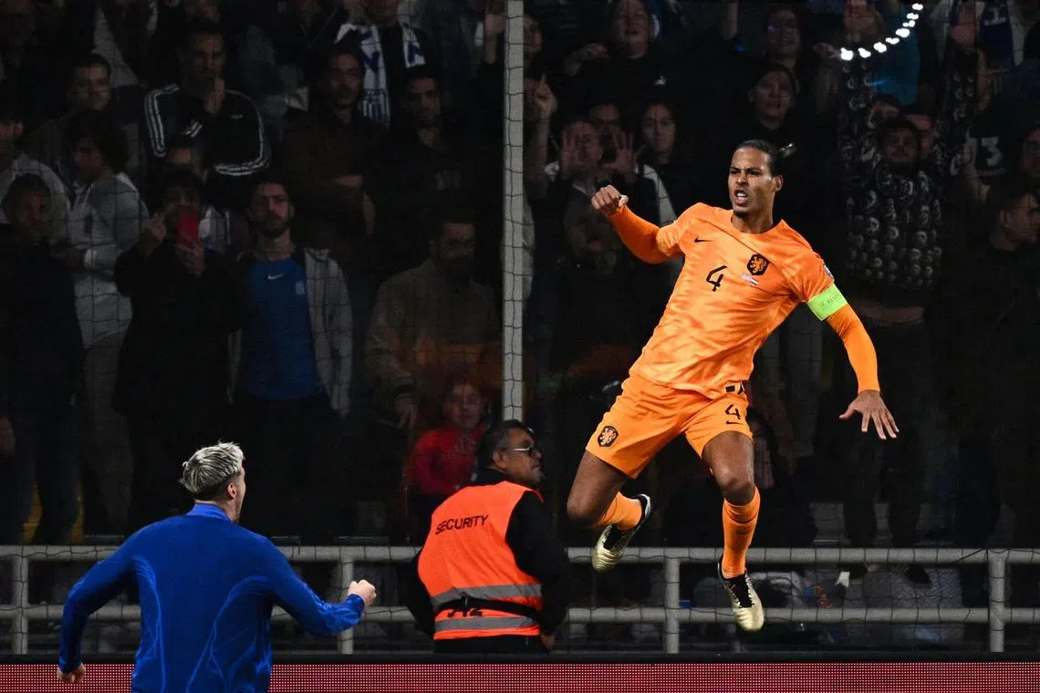 Netherlands captain Virgil van Dijk celebrating after scoring a penalty during the Euro 2024 qualifying group B football match against Greece at OPAP Arena in Athens.