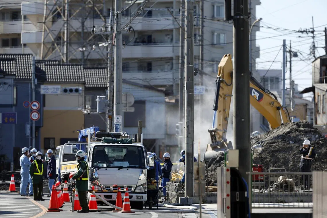 epa11865307 Workers dig to build a ramp to access a sinkhole where a truck fell, in Yashio, Saitama Prefecture, near Tokyo, Japan, 31 January 2025. Emergency services are searching for a truck driver who fell into a sinkhole on 28 January 2025, but the operation has been hampered by the risk of further collapse. Workers are building a ramp to allow heavy machinery to enter the area in order to rescue the 74 year-old driver.  EPA-EFE/FRANCK ROBICHON