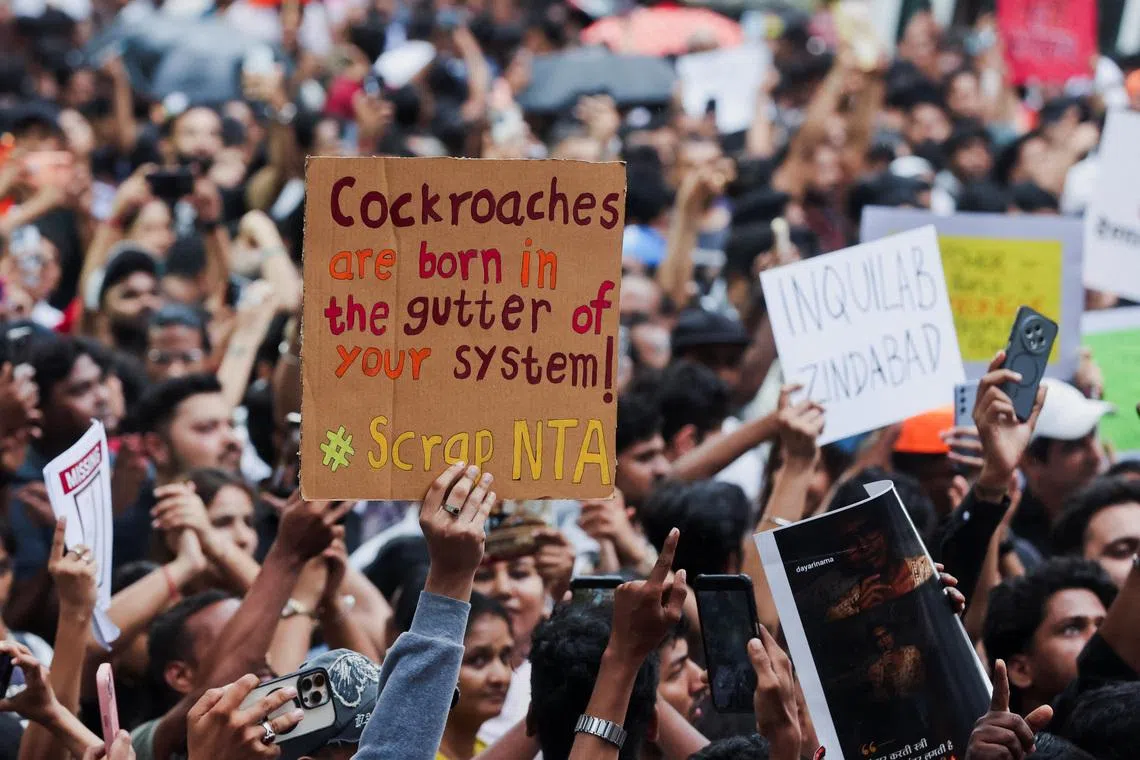 Cockroach Janta Party (CJP) supporters hold banners during a protest after authorities moved Sonam Wangchuk to a hospital during his hunger strike, as demonstrators demand the resignation of Indian Education Minister Dharmendra Pradhan, in Mumbai, India, July 19, 2026. REUTERS/Francis Mascarenhas