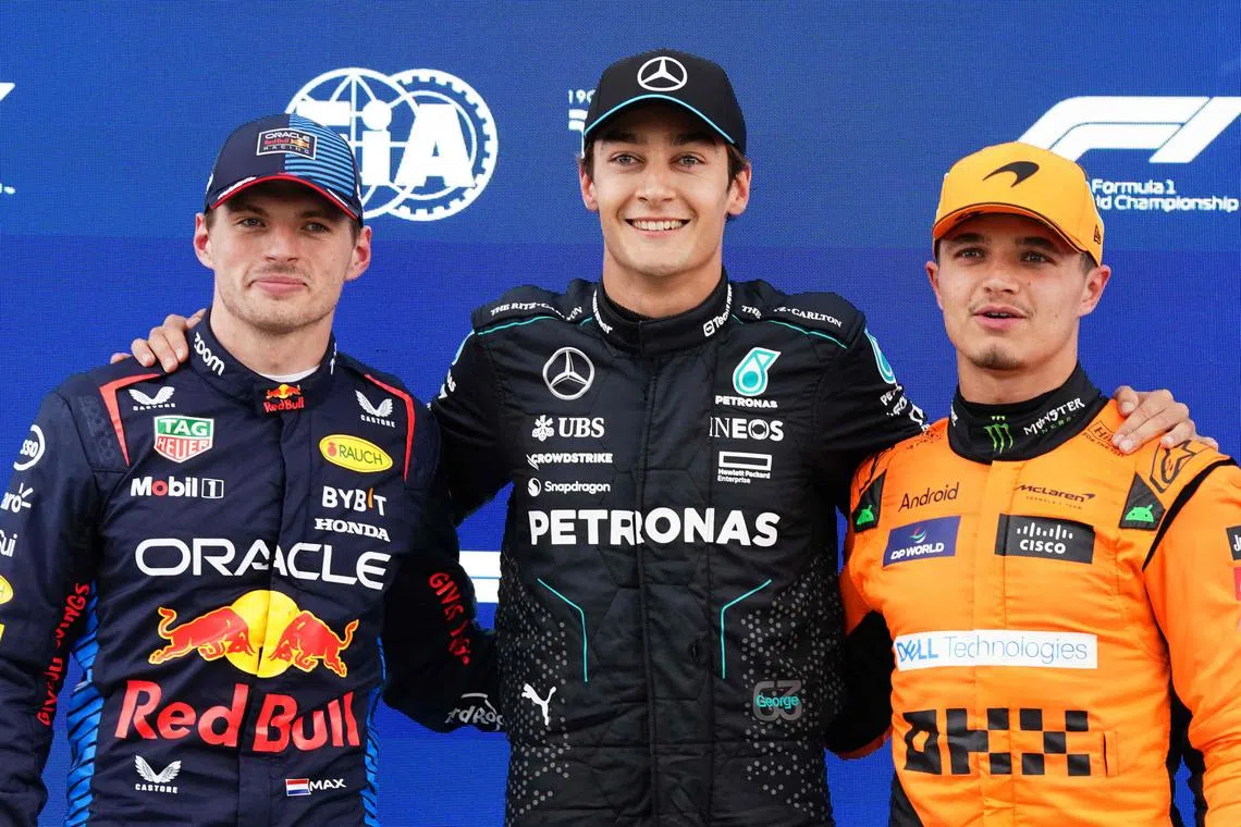Mercedes' George Russell (centre) scored pole position over Red Bull's Max Verstappen (left) because he set the time of 1 min 12 sec before him.  
McLaren's Lando Norris will take third place on the grid.