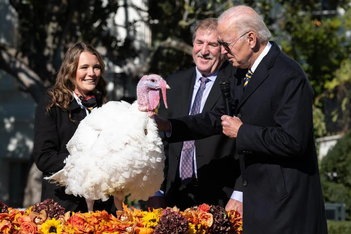President Joe Biden pardons a turkey named Chocolate during the 75th National Thanksgiving Turkey Presentation on the South Lawn of the White House in Washington on Monday, Nov. 21, 2022. (Cheriss May/The New York Times)