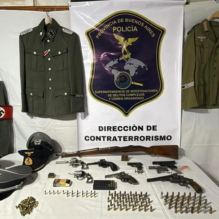 Nazi arsenal in this undated handout photo after Argentine police seized an arsenal of Nazi military uniforms, weapons, ammunition and accessories from a merchant in Buenos Aires province who was selling them online, according to a police statement, in Argentina. Policia de la Provincia de Buenos Aires/via REUTERS