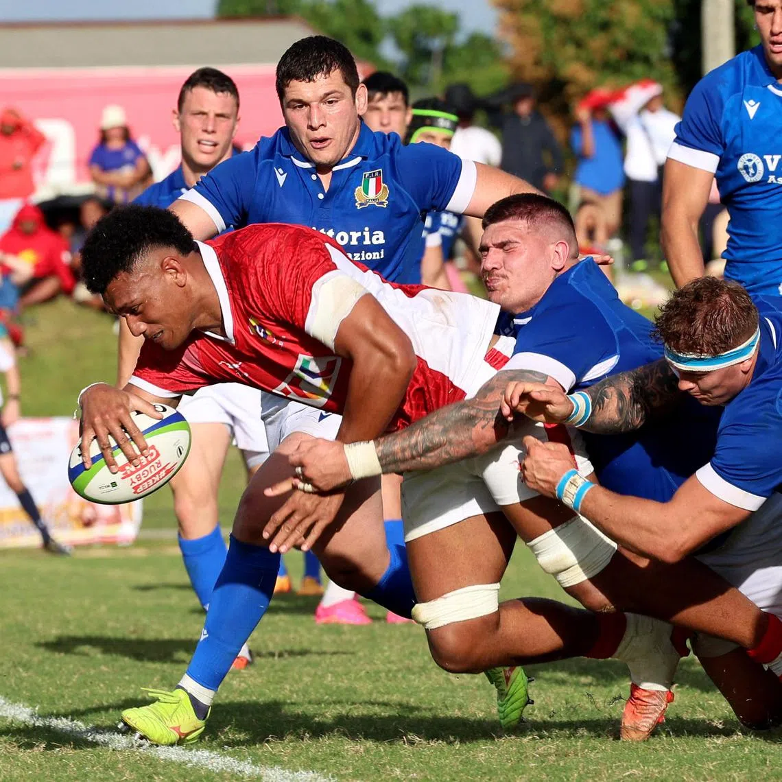 Tonga’s Viliami Taulani scores a try in the international rugby match against Italy at Teuifaiva Stadium in Nuku'alofa on July 12, 2024.