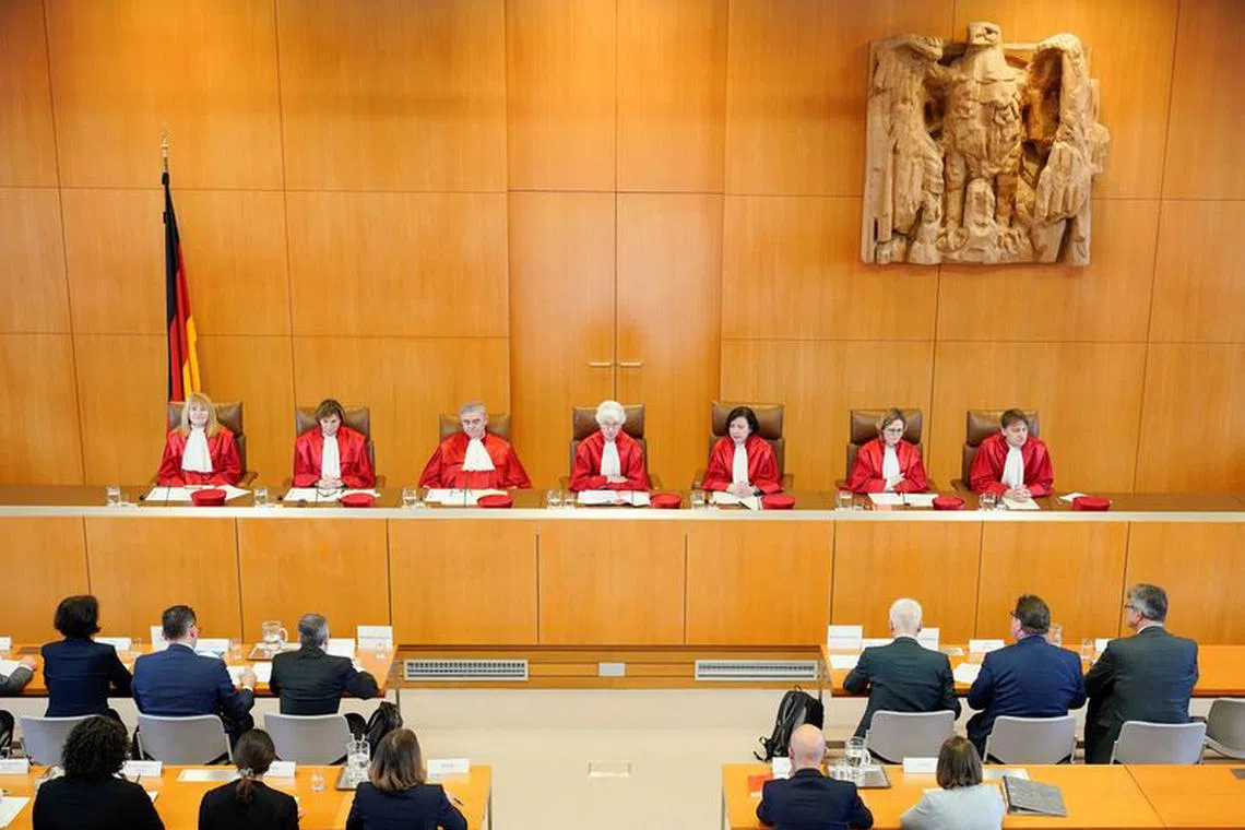 Members of second senate of the German Constitutional Court Rhona Fetzer, Christine Langengeld, Peter Mueller, vice president Doris Koenig, Sibylle Kessal-Wulf, Astrid Wallrabenstein and Thomas Offenloch sit in the courtroom to announce the verdict that parts of Germany's September 21, 2021 general elections for the Bundestag must be repeated in several Berlin election districts, at the seat of the highest German court in Karlruhe, Germany, December 19, 2023.    Uwe Anspach/Pool via Reuters