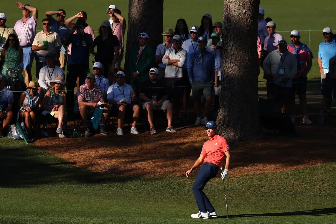 Golf - The Masters - Augusta National Golf Club, Augusta, Georgia, U.S. - April 13, 2024  Denmark's Nicolai Hojgaard reacts after chipping onto the green on the 15th hole during the third round REUTERS/Mike Blake