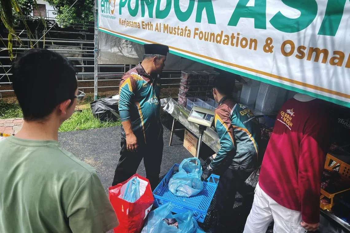 Goat meat being weighed at a collection and distribution centre run by Malaysian charity body Erth al-Mustafa Foundation at Osman Goat Farm in Kangkar Tebrau, Johor Bahru, during Hari Raya Haji on May 27.