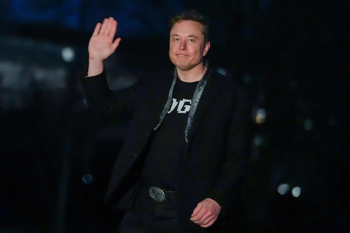 Elon Musk waves as he walks on the South Lawn of the White House after stepping off Marine One upon arrival at the White House in Washington DC on March 9. 
