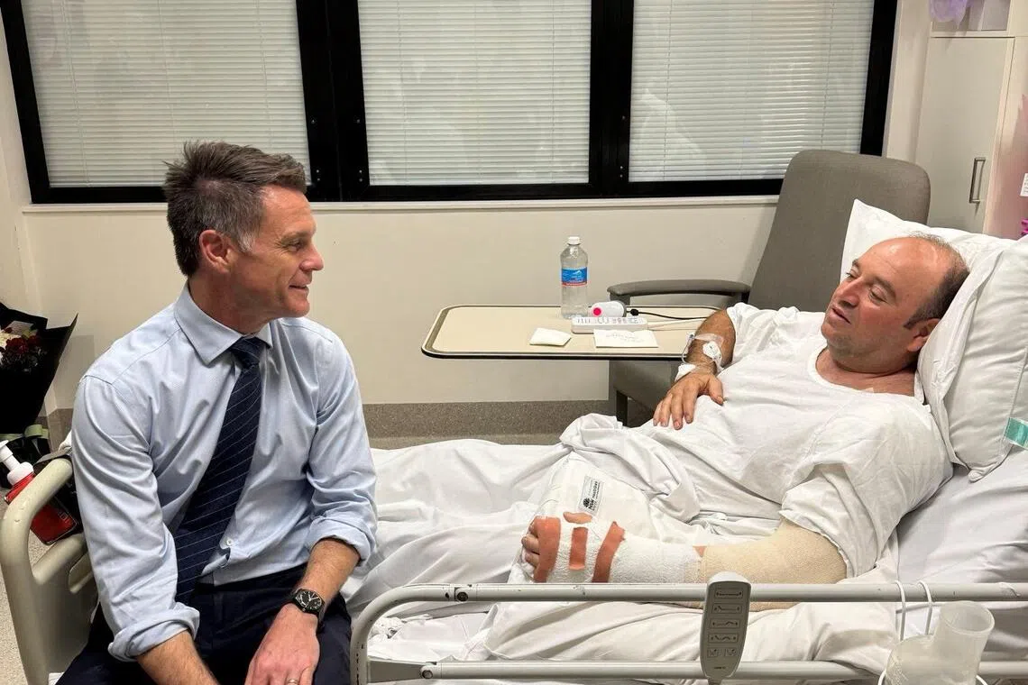 New South Wales Premier Chris Minns visits Mr Ahmed al Ahmed, a bystander who disarmed one of the Bondi Beach shooters, at a hospital in Sydney, Australia, Dec 15.