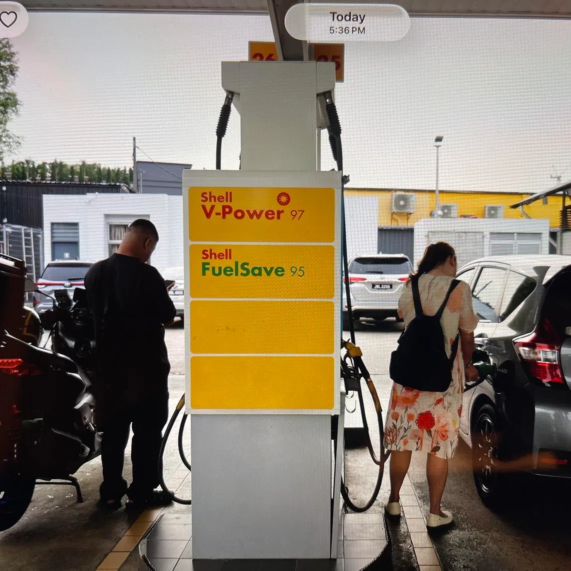 Motorists refuelling their vehicles at a Shell petrol station along Jalan Lingkaran Dalam in Johor Bahru on March 31.