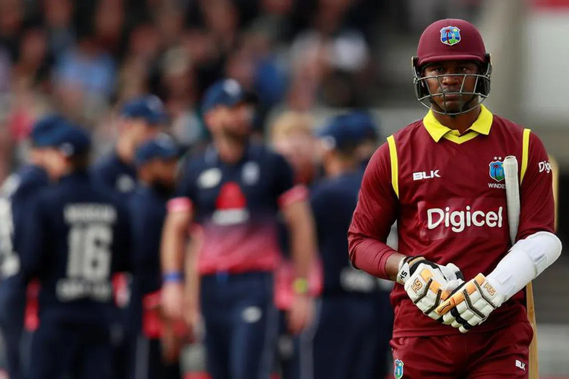 FILE PHOTO: Cricket - England vs West Indies - First One Day International - Emirates Old Trafford, Manchester, Britain - September 19, 2017    West Indies' Marlon Samuels looks dejected after losing his wicket   Action Images via Reuters/Jason Cairnduff/File Photo