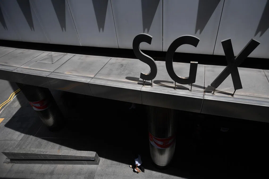 A man wearing a face mask walking outside SGX Centre 2 at Shenton Way in the Central Business District on September 1, 2020.