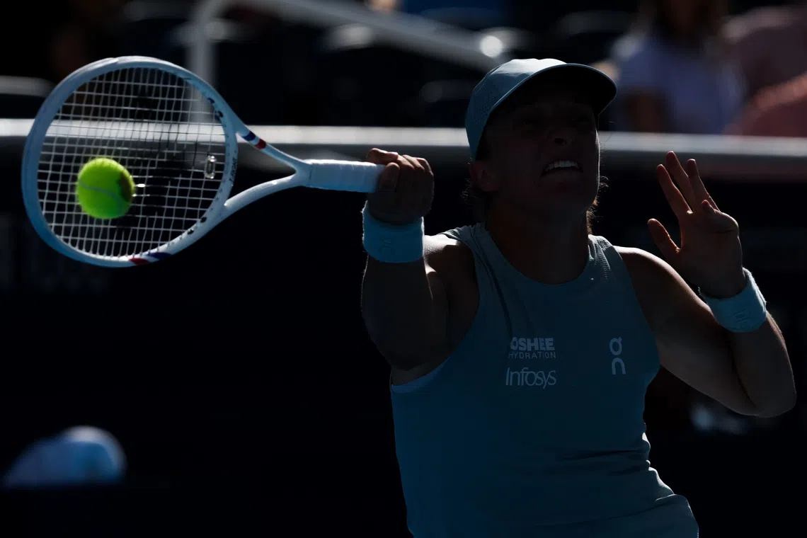 Aug 22, 2026; Mason, OH, USA;  Iga Swiątek (POL) returns a shot against Jessica Pegula (USA) during the Cincinnati Open at Lindner Family Tennis Center. Mandatory Credit: Aaron Doster-Imagn Images