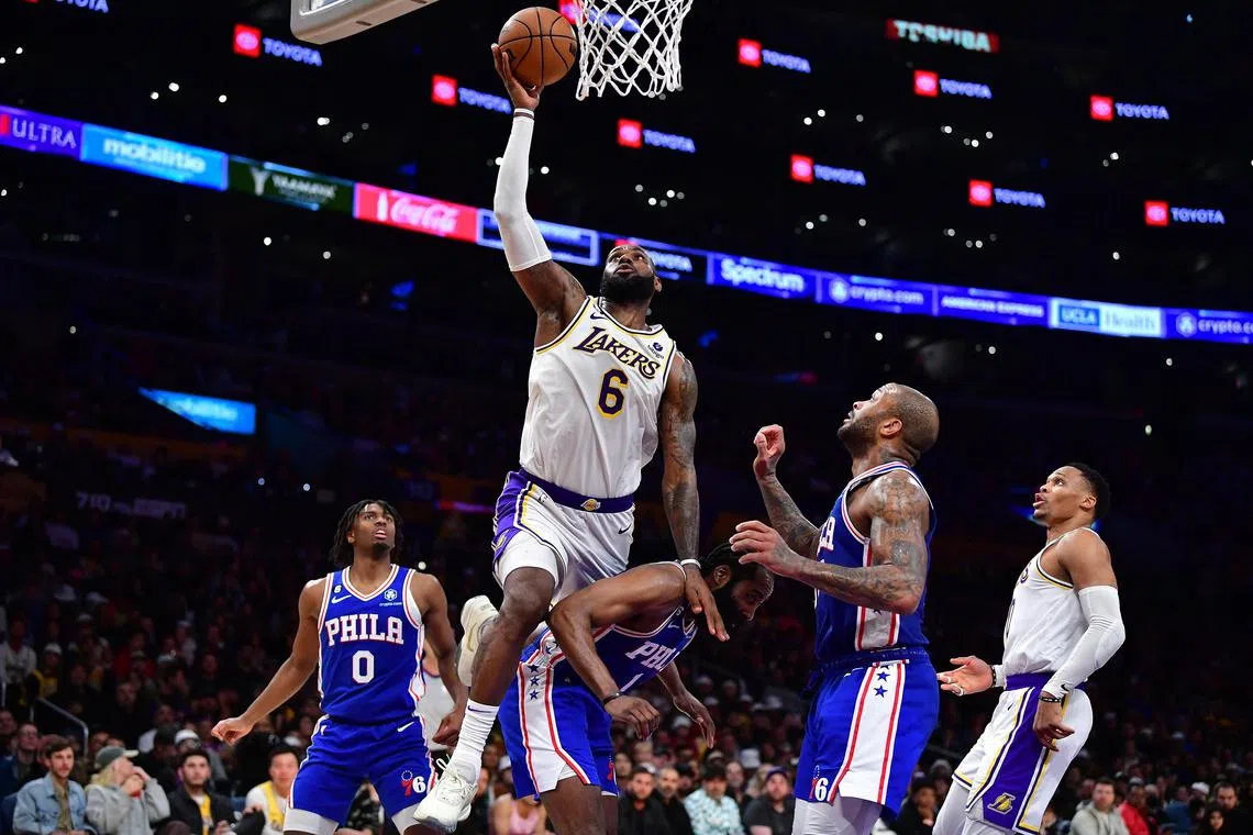 Los Angeles Lakers forward LeBron James attempting to score against the Philadelphia 76ers at Crypto.com Arena on Sunday. The Sixers edged out the hosts 113-112 on the night. 