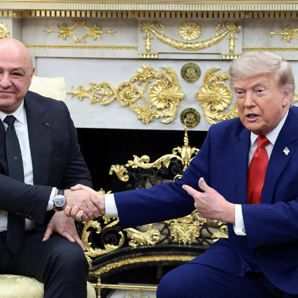 US President Trump (right) shakes hands with Lebanese President Joseph Aoun during their meeting at the White House on July 21.