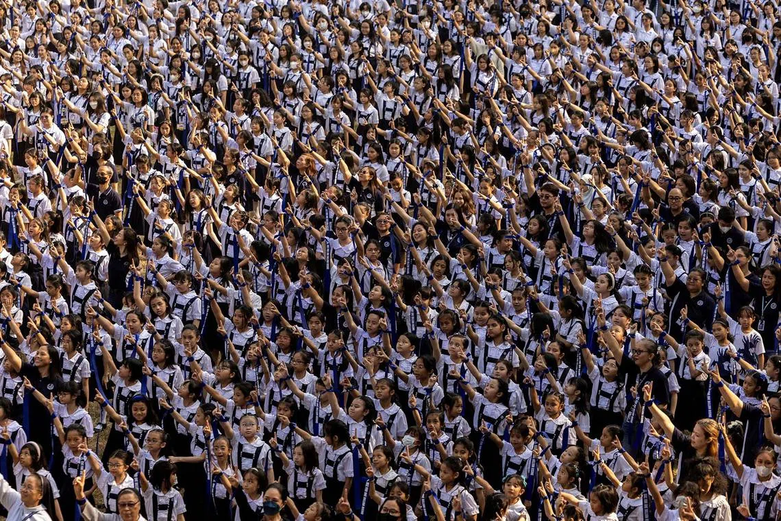 Filipino students dance to take part in the One Billion Rising global campaign to end violence against women and advance gender equality, at St Scholastica's College in Manila, Philippines, February 15, 2024. REUTERS/Eloisa Lopez TPX IMAGES OF THE DAY