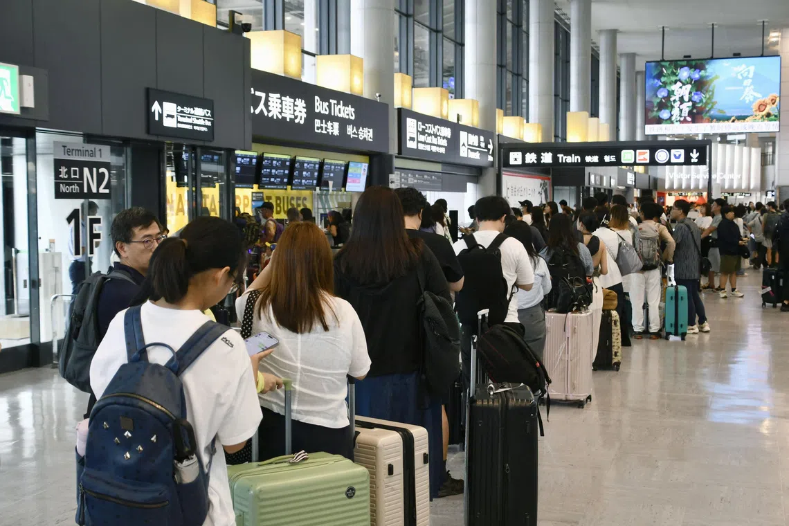 Travellers stranded due to heavy rain crowd Narita International Airport in Narita, Japan’s Chiba prefecture, on Aug 14.