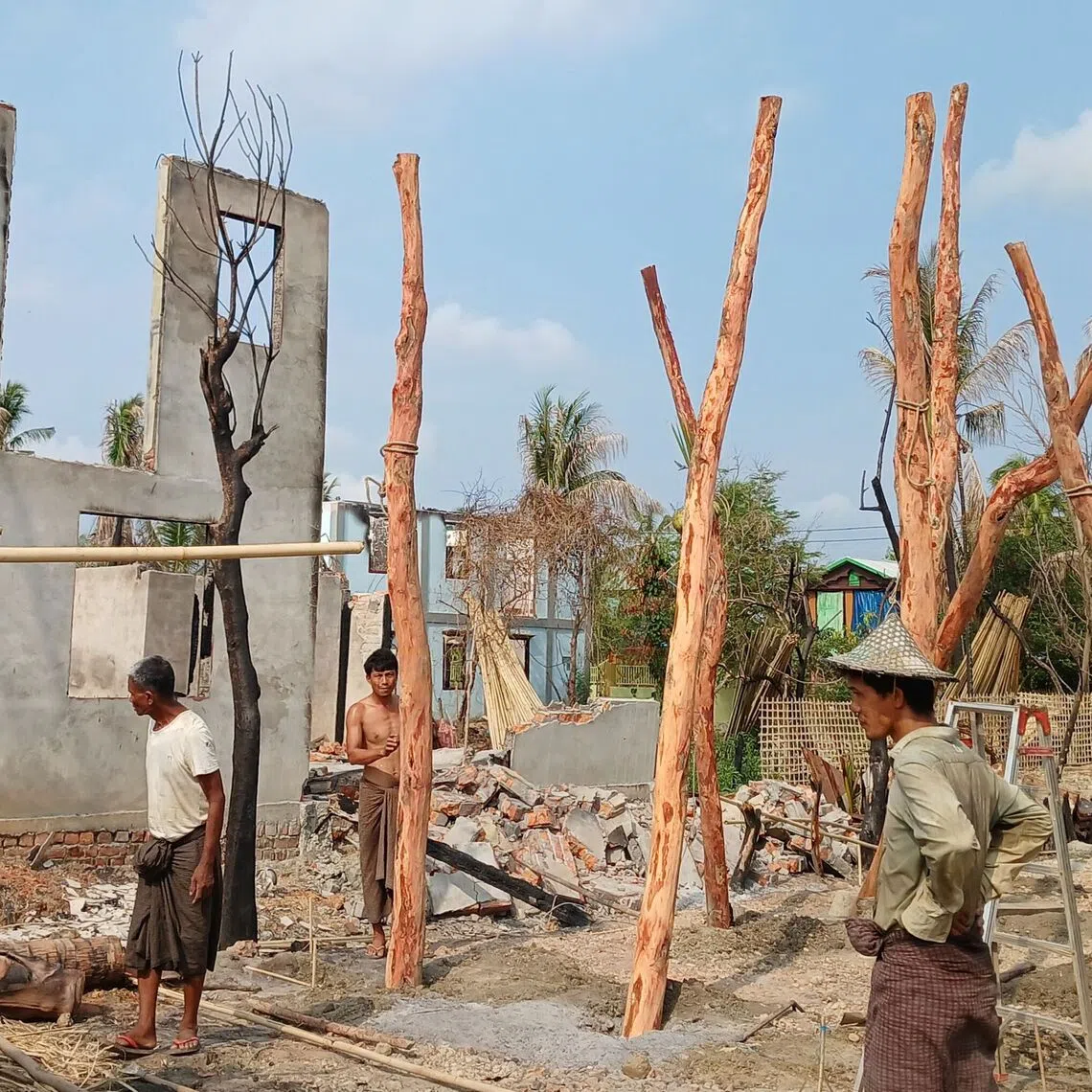 People building temporary homes following fighting between Myanmar's military and the Arakan Army ethnic minority armed group in Rakhine state in May 2024.