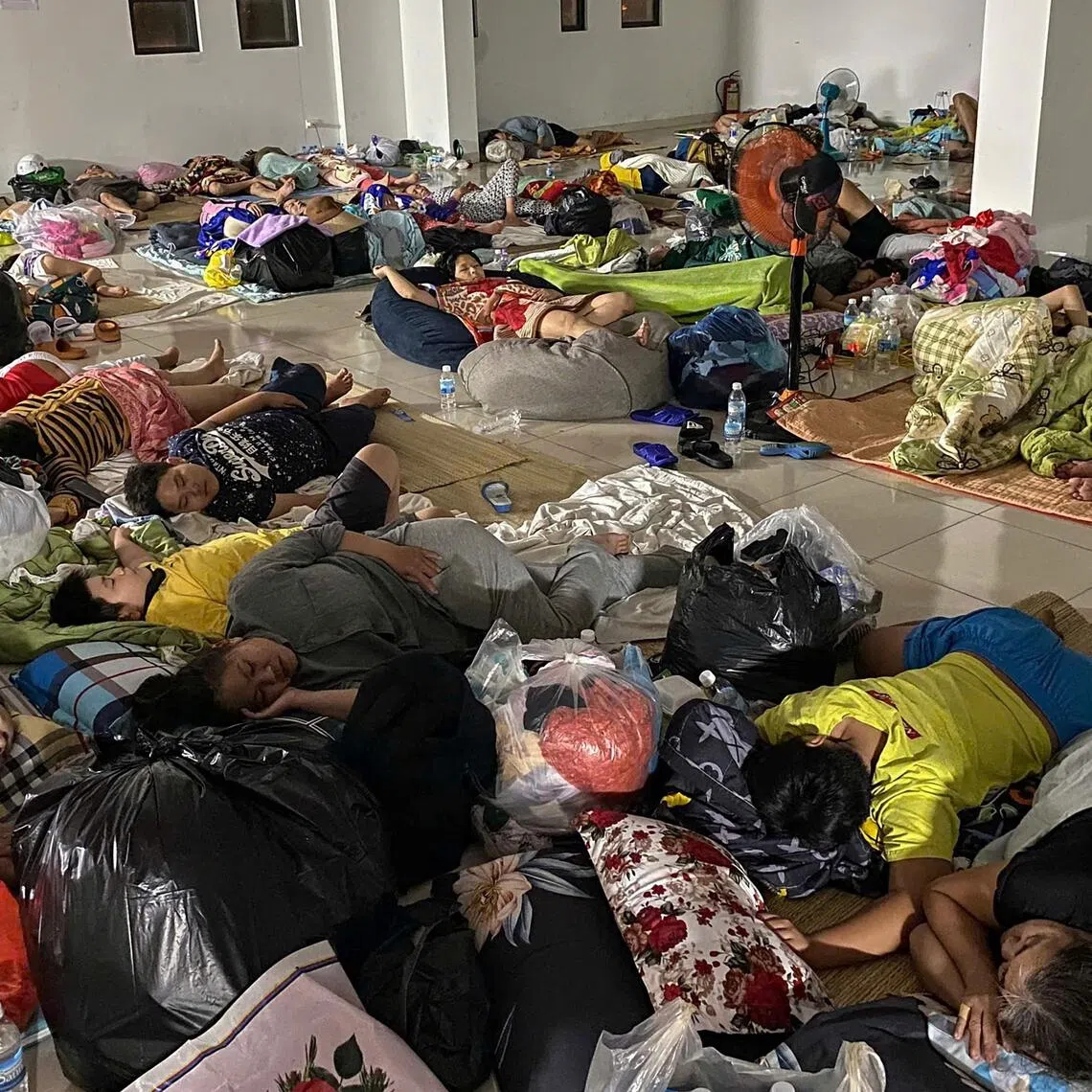 People displaced by floods resting in a shelter in Nha Trang province, Vietnam, on Nov 20.
