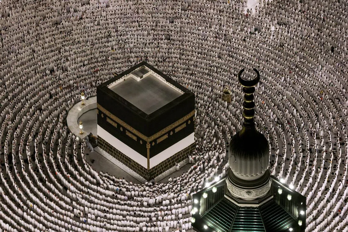 Muslim worshippers gather to pray around the Kaaba, Islam's holiest shrine, at the Grand Mosque complex in the holy city of Mecca on June 1.