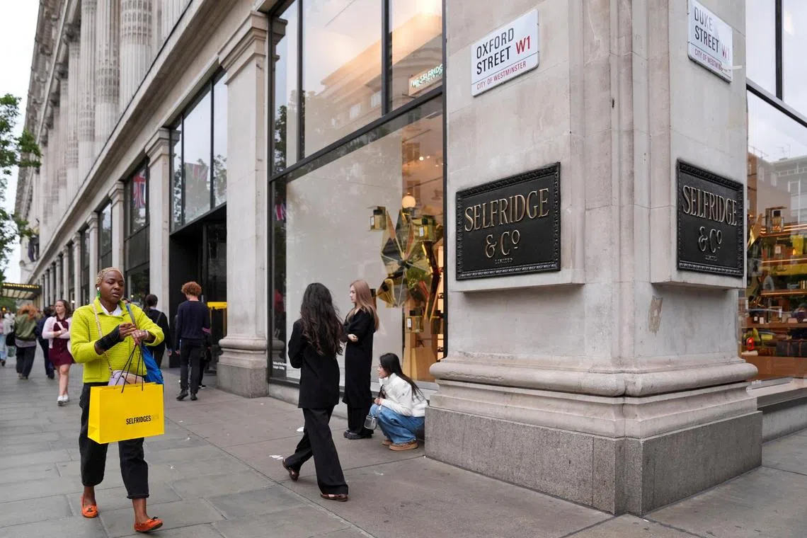 Shoppers walk past Selfridges store, at Oxford Street, in London, Britain, May 15, 2025. REUTERS/ Maja Smiejkowska

