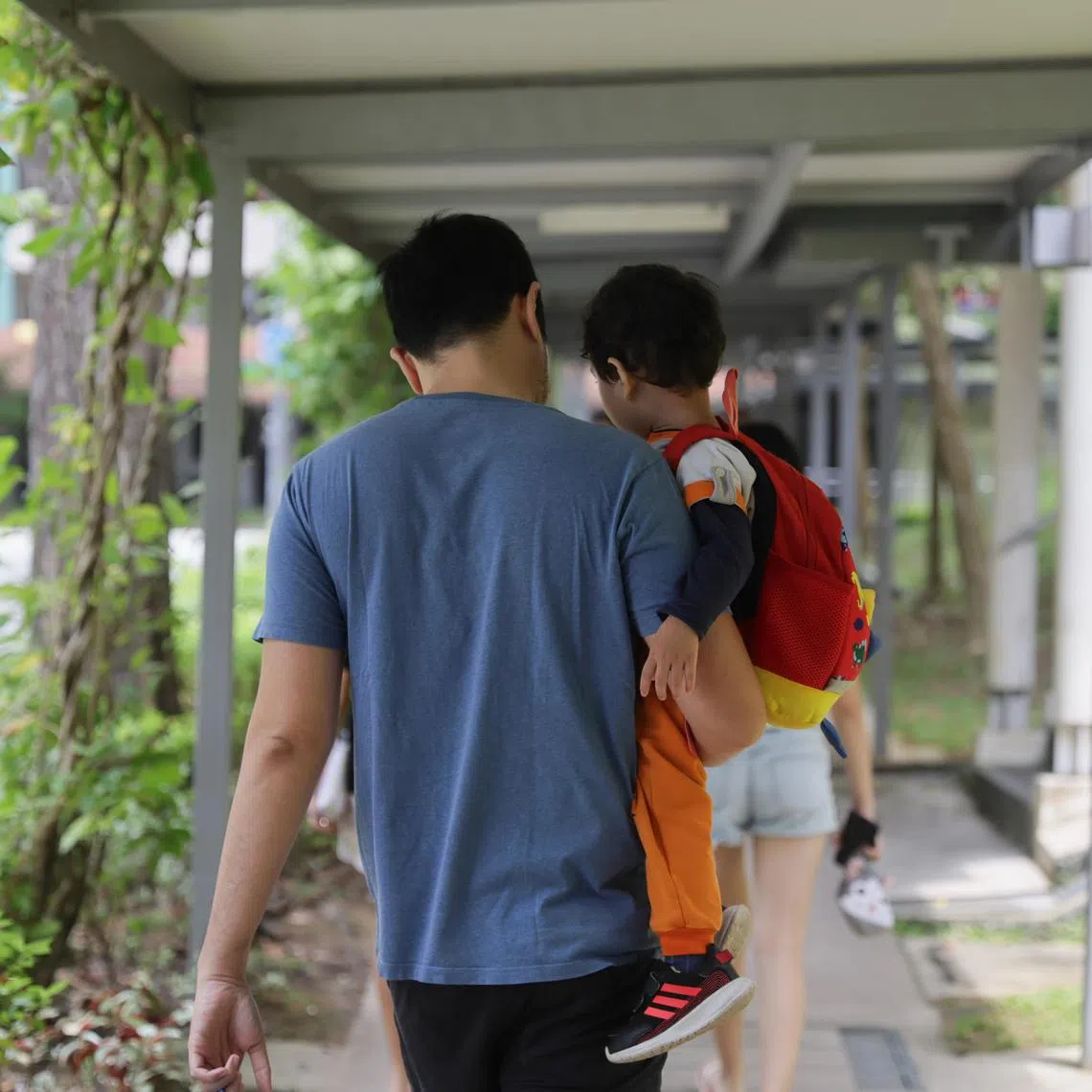A father carrying his preschooler child at Tiong Bahru, 24 October 2023. Can use for stories on parenting, fatherhood, family, family planning, childcare, single parent,