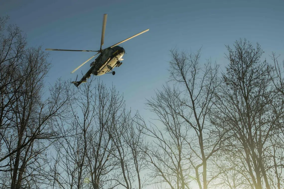 A Ukrainian military helicopter flying over Ukraine's Sumy region on April 15.