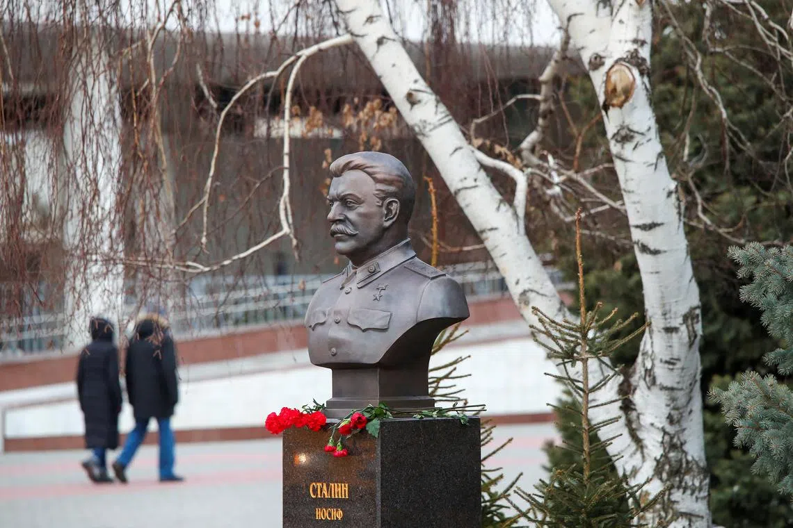 FILE PHOTO: Red carnations are placed under the bronze bust of Soviet leader Josef Stalin, which was recently unveiled to mark the 80th anniversary of the Red Army's defeat of Nazi Germany's troops in the Battle of Stalingrad that became the deadliest and one of the most decisive fightings during World War Two, at a panorama museum in Volgograd, Russia, February 3, 2023. REUTERS/Kirill Braga/File Photo