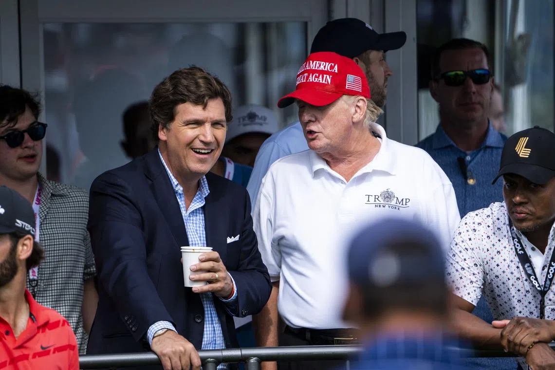 Tucker Carlson (left) and former President Donald Trump at Trump National Golf Club in Bedminster, New Jersey, in 2022.