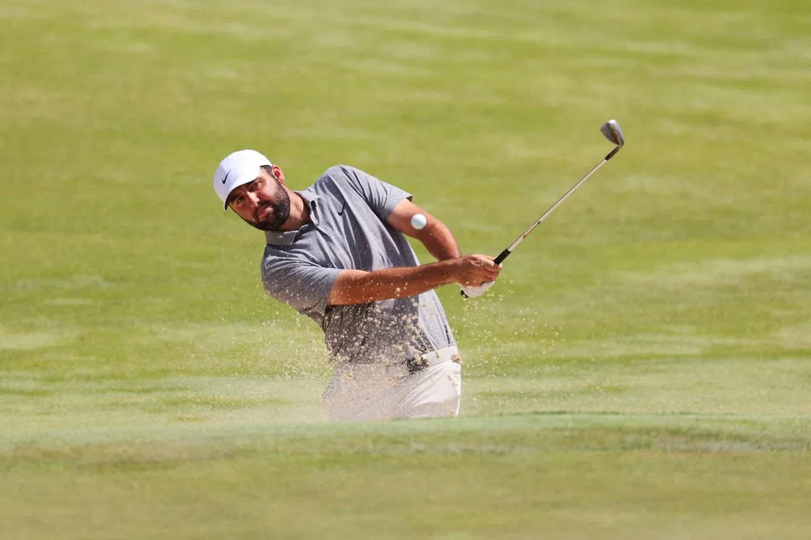 Scottie Scheffler of the United States playing a shot out of the bunker during the third round of the PGA Championship at Valhalla Golf Club on May 18 in Louisville, Kentucky. He sits at seven-under for the tournament after a 73 on May 18.