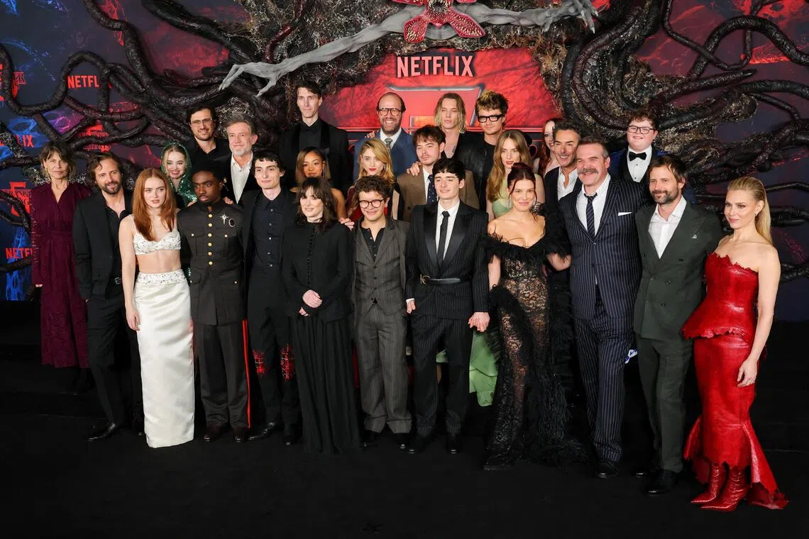 Cast members Sadie Sink, Caleb McLaughlin, Finn Wolfhard, Gaten Matarazzo, Noah Schnapp, Millie Bobby Brown, Joe Keery, Maya Hawke, Winona Ryder, David Harbour and Natalia Dyer, and creators Matt Duffer and Ross Duffer, along with other cast members at the premiere for the final season of Stranger Things at the TCL Chinese Theatre in Los Angeles on Nov 6.