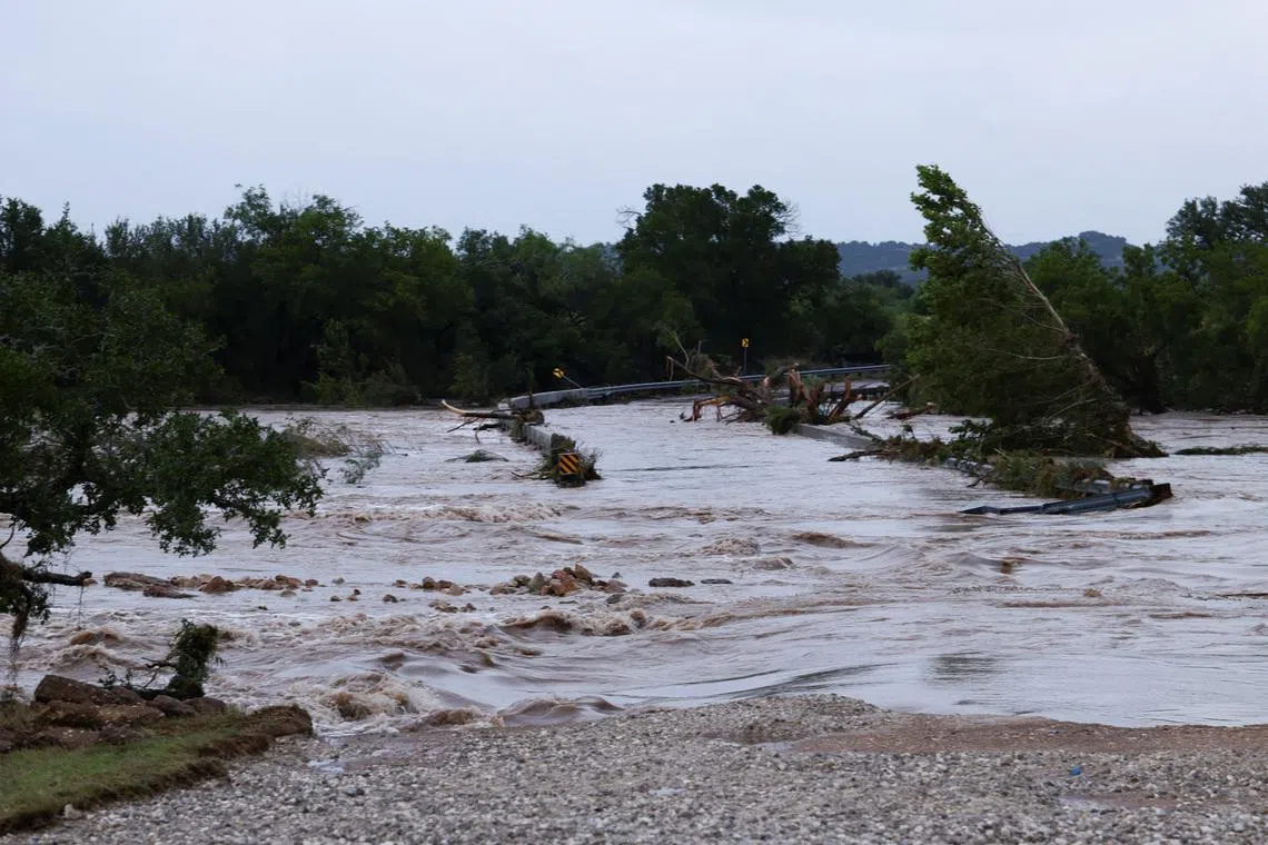 The Pedernales River rises over Old San Antonio Road as heavy rains and severe weather hit southern Texas near Fredericksburg, Texas, U.S., July 16, 2026. REUTERS/Kaylee Greenlee
