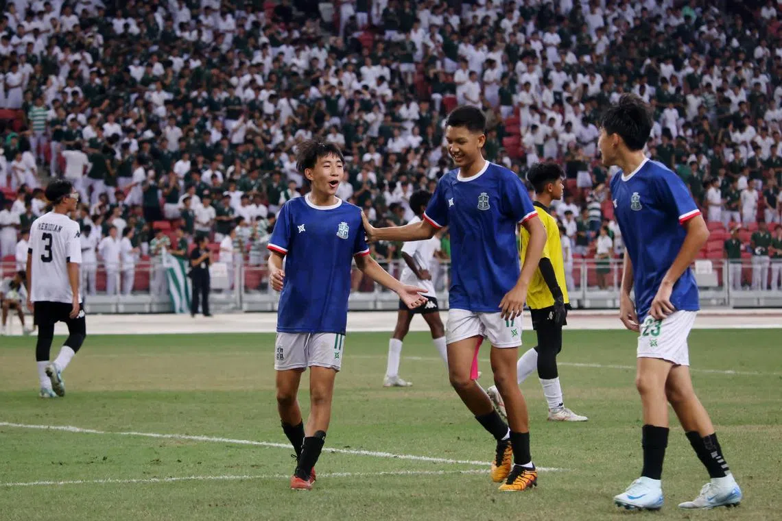 St Joseph's Institution's Gavriel Lai (left) celebrates with Aidan Irfan (centre) and Ethan Lim. Gavriel and Aidan are departing for Spain as Unleash The Roar! scholarship recipients.