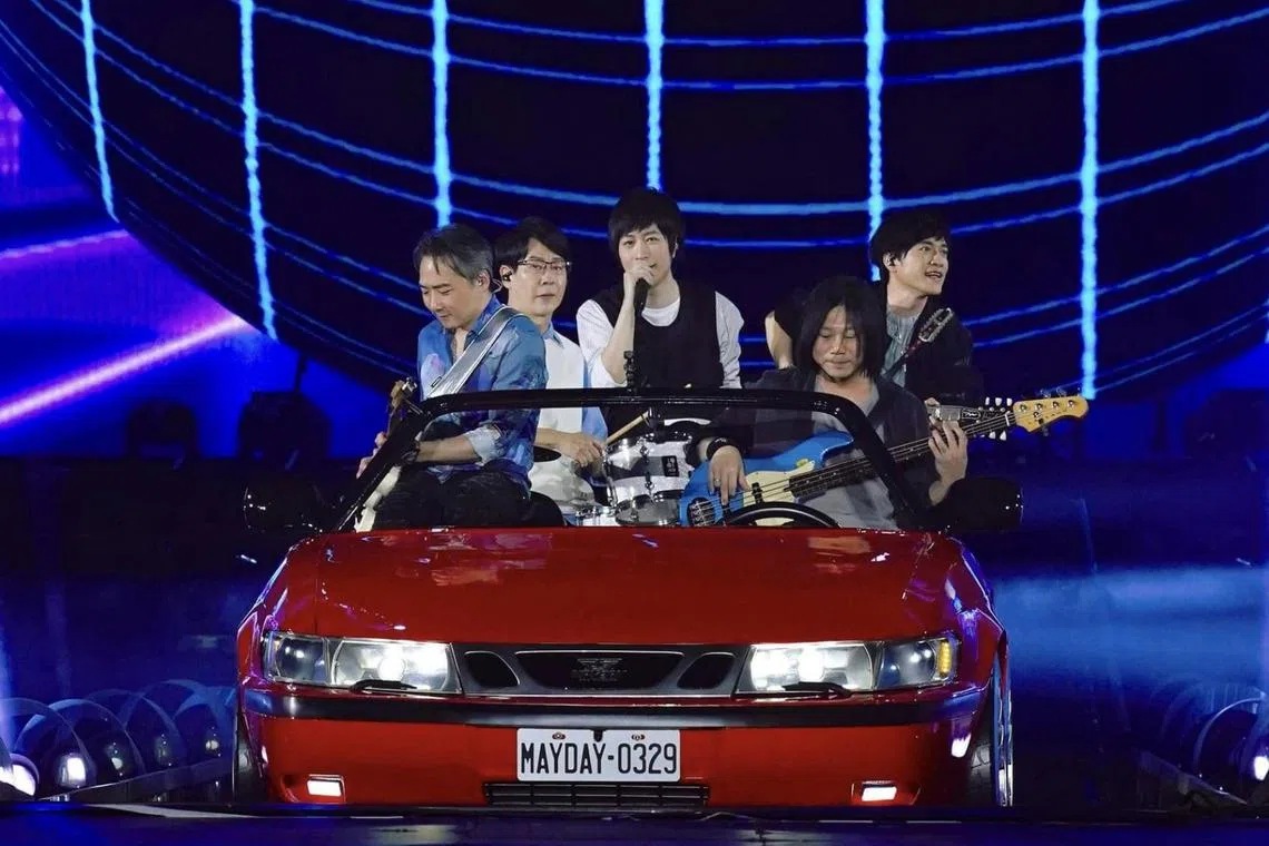 Taiwanese rock band Mayday, consisting of (from left) guitarist Stone, drummer Guan You, lead vocalist Ashin, bassist Masa and guitarist Monster during a concert in Kaohsiung in March 2024.