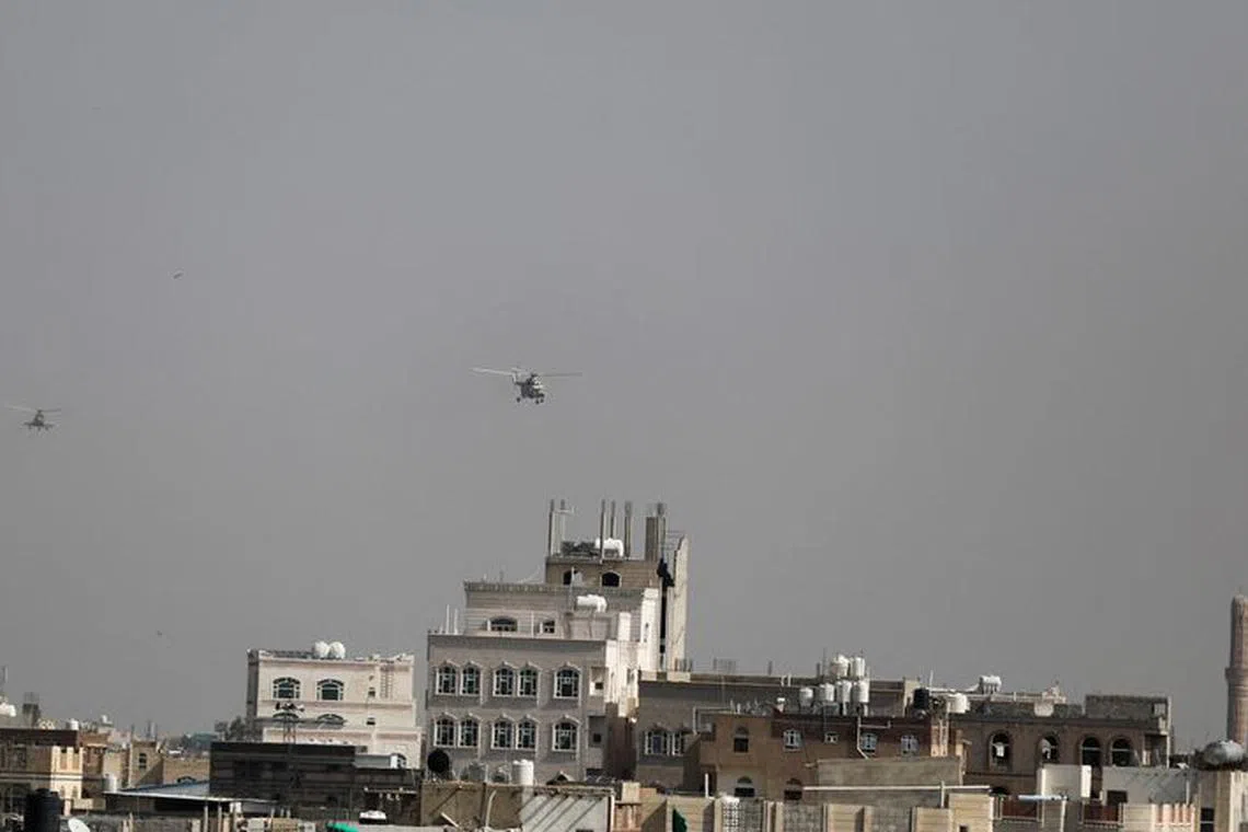 Military helicopters, operated by the Houthis, fly over Sanaa, Yemen September 21, 2022 for the first time since the Saudi-led coalition intervened in Yemen and controlled the country's airspace in 2015. REUTERS/Khaled Abdullah/File photo