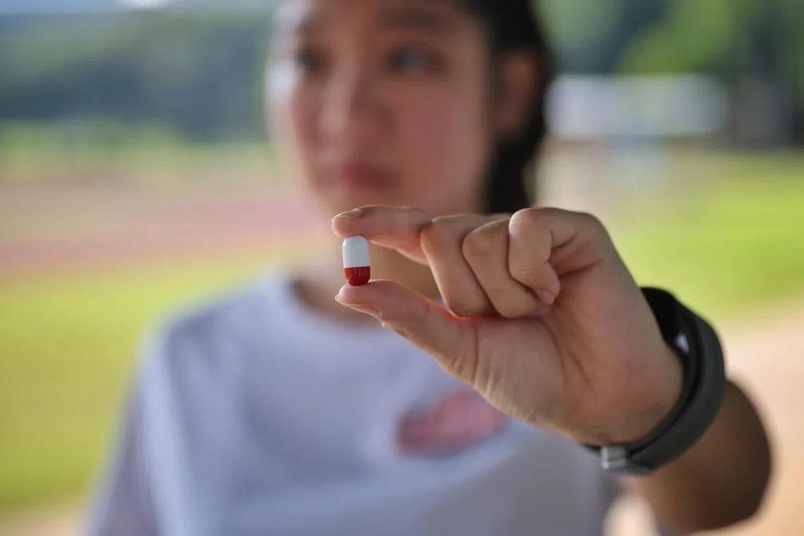 ST20231103_202364561153/ocpill03/Osmond Chia/Jason Quah
Photo illustration of a runner holding a pill that measures temperature. Pic taken on 3 Nov, 2023.
//
Runners are popping pills that measure the precise core temperature to help ensure sportsmen aren't overexerting during their workouts. NUS and Samsung have tested the pill-sized trackers, which runners ingest, during marathons to build a sizeable database for the project.The study aims to improve the accuracy of temperature readings measured on the skin's surface by smartwatches and other wearables, which can in turn help to monitor seniors' health and build predictive technology for heat injury cases.