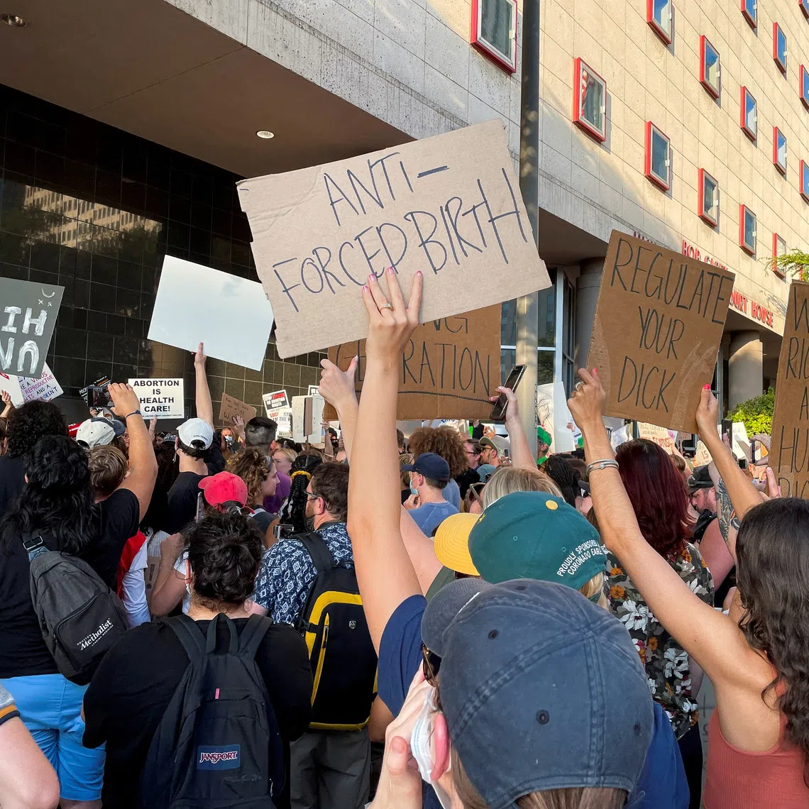 People gather to protest in response to the U.S. Supreme Court ruling overturning Roe v. Wade abortion rights decision, in Houston, Texas, U.S. June 24, 2022. Picture taken June 24, 2022. REUTERS/Sabrina Valle/File Photo