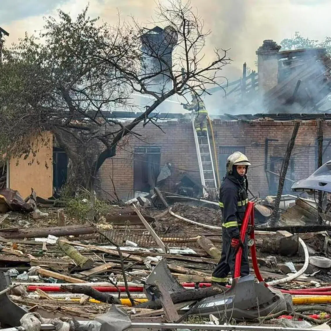 Ukrainian rescuers working at the site of a Russian missile strike in the Kyiv region on July 24.