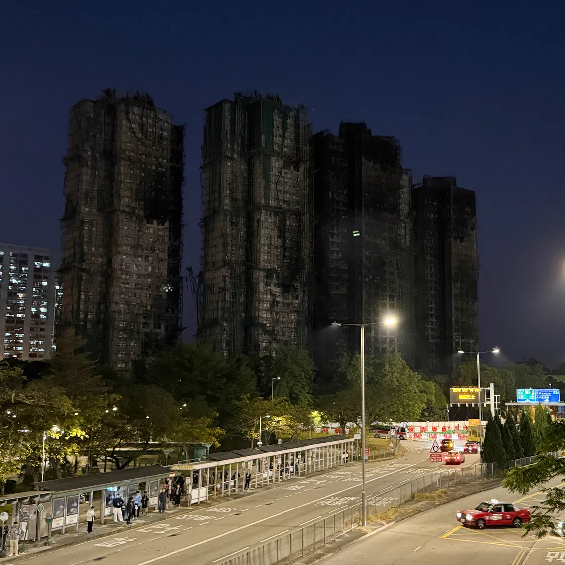 The charred towers of Wang Fuk Court in Tai Po after a devastating fire tore through the high-rise estate in November 2025.