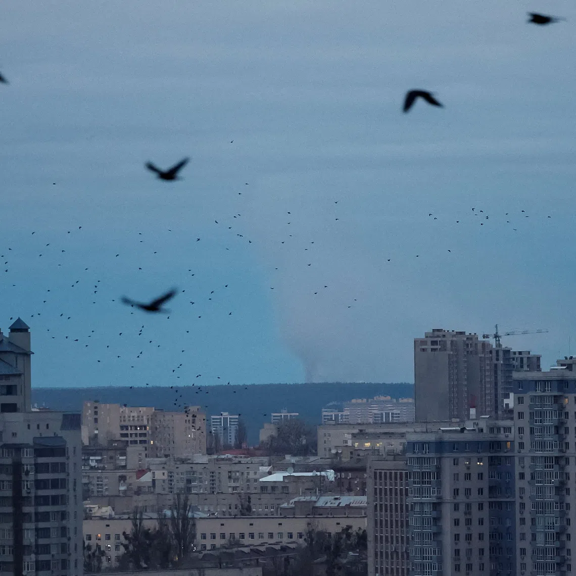 Smoke rises in the city after Russian drone and missile strikes in Kyiv on Dec 23. Amid the continued fierce fighting, territory remains the main diplomatic stumbling block.
