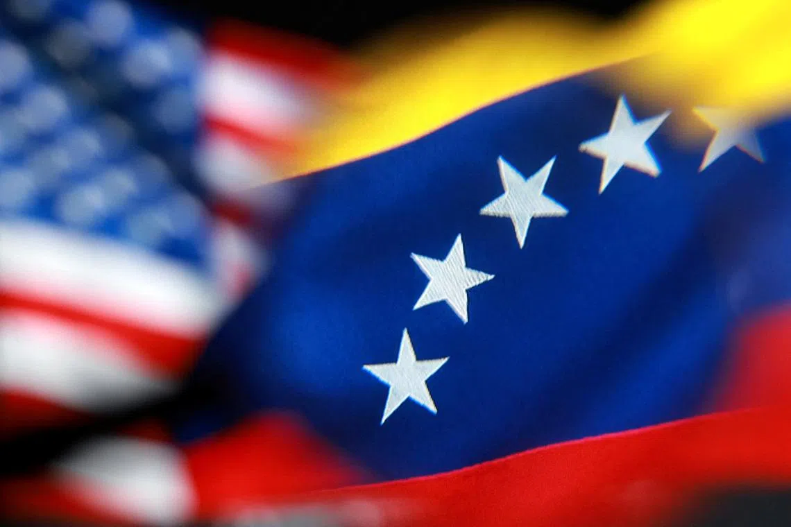 U.S. and Venezuelan flags appear in this illustration taken December 2, 2025. REUTERS/Dado Ruvic/Illustration
