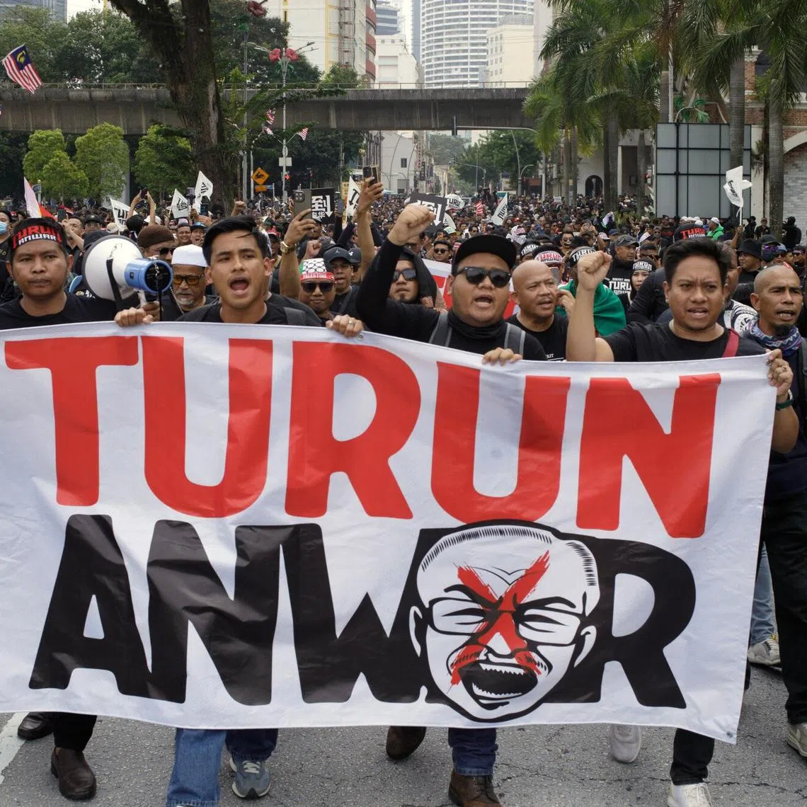 Protesters hold a banner during a demonstration calling for the resignation of Malaysian Prime Minister Anwar Ibrahim in Kuala Lumpur, Malaysia, on July 26.